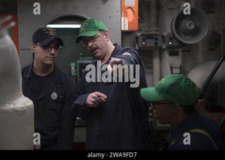 US military forces. 180807EV253-004 ATLANTIC OCEAN (Aug. 7, 2018) Chief Gas Turbine Systems Technician (Electrical) Michael Bocash, right, provides training to Hull Maintenance Technician Fireman Apprentice Adrian Mendez during engineering drills aboard the Arleigh Burke-class guided-missile destroyer USS Bulkeley (DDG 84) Aug. 7, 2018. Bulkeley, homeported at Naval Station Norfolk, is conducting naval operations in the U.S. 6th Fleet area of operations in support of U.S. national security interests in Europe and Africa. (U.S. Navy photo by Mass Communication Specialist 3rd Class Sara Eshleman Stock Photo