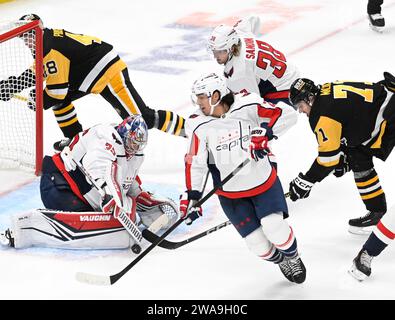 Pittsburgh, United States. 02nd Jan, 2024. Washington Capitals goaltender Darcy Kuemper (35) clears the puck away from Pittsburgh Penguins center Evgeni Malkin (71) during the second period of the Capitals 4-3 win Pittsburgh Penguins at PPG Paints Arena in Pittsburgh on Tuesday, January 2, 2024. Photo by Archie Carpenter/UPI. Credit: UPI/Alamy Live News Stock Photo