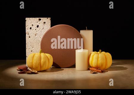 Round podium in brown color arranged with two pumpkins, white candles and some spices. Thanksgiving day present, seasonal sale concept. Stock Photo