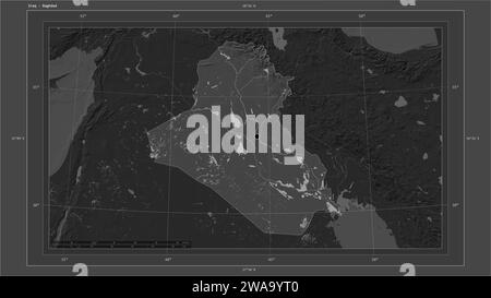 Iraq highlighted on a Bilevel elevation map with lakes and rivers map with the country's capital point, cartographic grid, distance scale and map bord Stock Photo