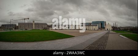 Ebrington square, landmark of old army barracks in londonderry or derry on a cloudy day. Memorial place of northern ireland conflict, wide panorama. Stock Photo