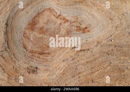 Weathered and worn marble wall of pink and orange color Stock Photo