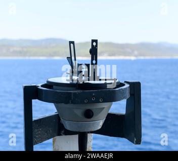 Azimuth ring on gyro compass. Direction finder on the navigational bridge. Azimuth vane. Bearing finder. Navigational equipment. Stock Photo