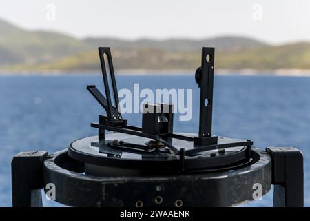 Azimuth ring on gyro compass. Direction finder on the navigational bridge. Azimuth vane. Bearing finder. Navigational equipment. Stock Photo