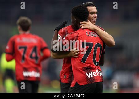 Milano, Italy. 02nd Jan, 2024. Chaka Traore of Ac Milan (F) celebrates with his team mate Jan-Carlo Simic of Ac Milan (R) after scoring a goal during the Coppa Italia football match beetween Ac Milan and Cagliari Calcio at Stadio Giuseppe Meazza on January 2, 2024 in Milano, Italy . Credit: Marco Canoniero/Alamy Live News Stock Photo