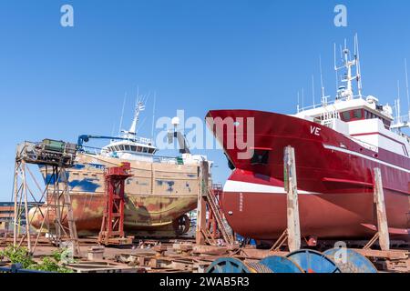 Reykjavik, Iceland - July 10, 2023: Boats and ships getting a fresh paint job in the shipyard at the harbor Stock Photo