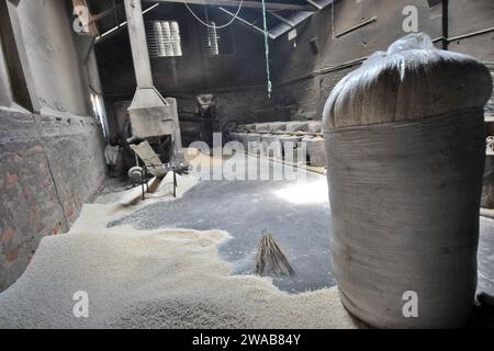 Puff Factory Rice Bangladeshi worker works in a puffed rice factory in Dhaka City in ...