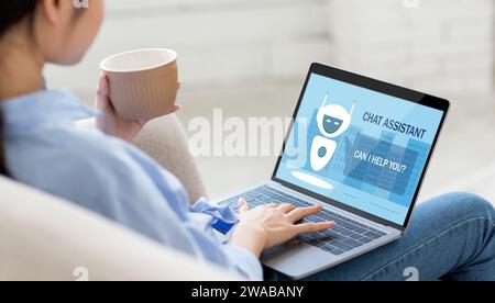 Unrecognizable relaxed woman using chat assistant on laptop Stock Photo