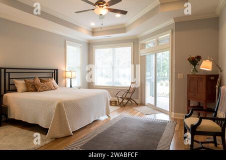 Large master bedroom in  a suburban residential house features a king size bed, and ceiling fan, South Carolina, United States, 2017, USA Stock Photo