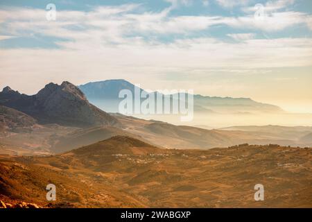 Beautiful and idyllic panoramic landscape of the Montes de Málaga Natural Park, Andalucia, Spain, with the first light of dawn Stock Photo