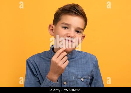 Teen Skin Problem. Upset Teenage Boy Touching Pimple On His Face Stock Photo