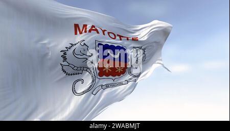 Flag of Mayotte waving in the wind on a clear day. Overseas department and region of France. 3d illustration render. Fluttering fabric. Stock Photo