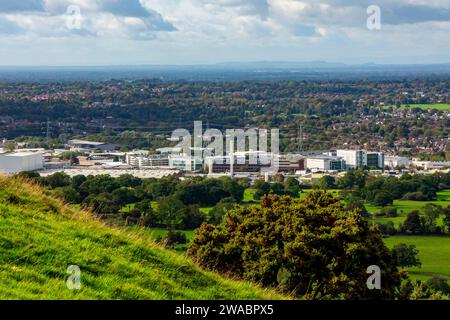 View looking down on the Astra Zeneca factory in Macclesfield Cheshire England UK with the Cheshire Plain visible in the distance. Stock Photo