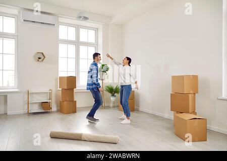 Happy couple dancing in their hoome on moving day Stock Photo