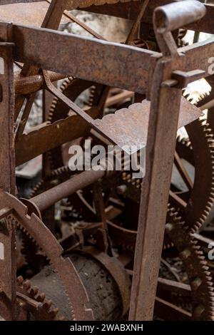 Close-up of rusty mechanical gears of tower clock and metal structure. Stock Photo
