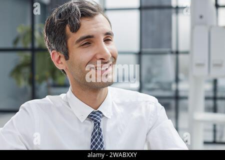 Confident and focused young designer standing in an office Stock Photo