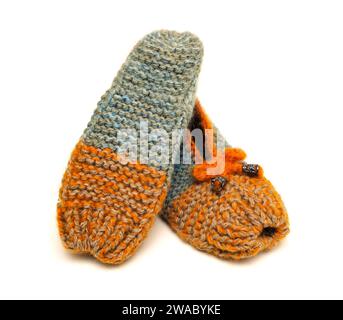 Handmade colorful  made in wool slippers on a white background Stock Photo