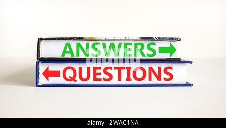 Questions and answers symbol. Concept word Questions Answers on beautiful books. Beautiful white table white background. Business questions and answer Stock Photo