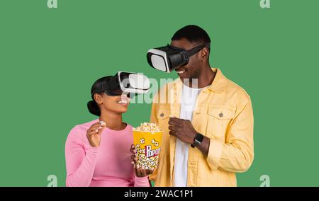 Black couple wearing VR headset, watching movie Stock Photo