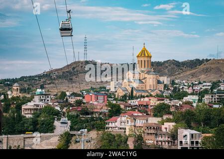 View of the Sameba Cathedral and the Tbilisi ropeway,  in Tbilisi old town, Georgia Stock Photo