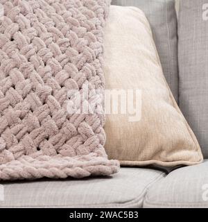 Knitted light pink plaid handmade close-up. Stock Photo
