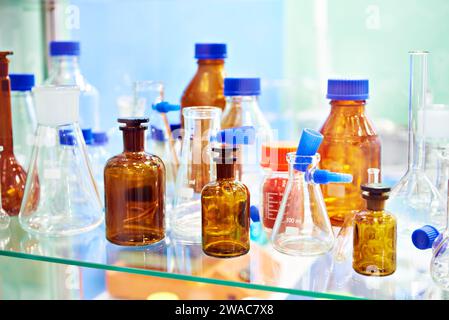 Laboratory glass dishes, bottles, jars and flasks in store Stock Photo