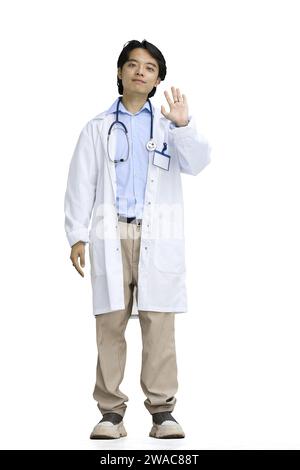The guy is a doctor, on a white background, in full height, waving his hand Stock Photo
