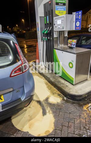 Sand on fuel spill at filling station, Abergavenny, Wales, UK Stock Photo