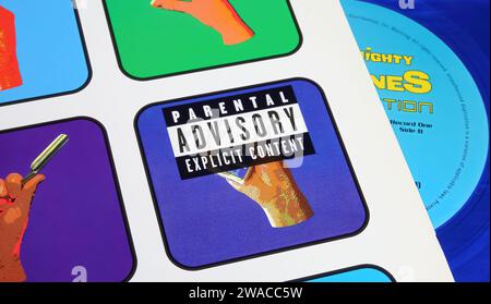 Viersen, Germany - May 9. 2023: Closeup of warning label Parental Advisory explicit content  on vinyl record music album cover Stock Photo