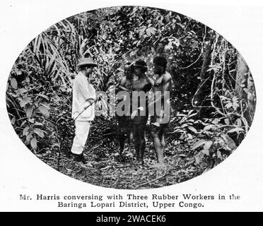 halftone of an overseer, a Mr Harris, discussing issues with three rubber workers in the Baringa Lopari District, upper Congo, circa 1913 Stock Photo