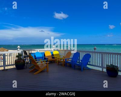 The reef off of the north side of Cayman Islands on a beautiful sunny day with colorful chairs. Stock Photo