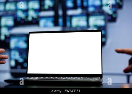 Teamworking colleagues using mock up laptop to check supercomputers, close up. Infrastructure in computer network security server farm providing processing and memory resources for several workloads Stock Photo