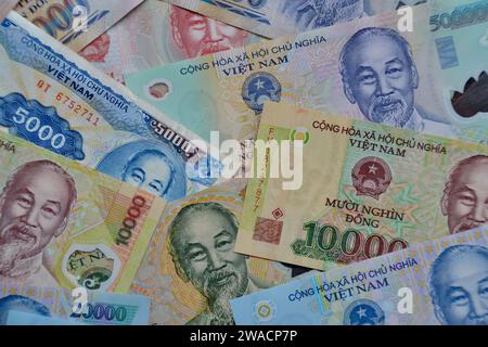 Many bank notes laid out flat in a collage a high denomination Vietnamese Dong as a concept for wealth, finance and business Stock Photo