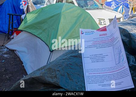Denver, Colorado - Immigrants, mostly from Venezuela, live in a tent camp near downtown Denver. Notices placed on tents by the city warn migrants that Stock Photo