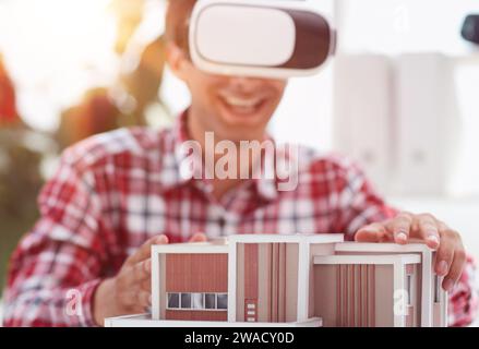 Architecture design drawings, building model on blueprint floor plan, house construction. 3d Stock Photo