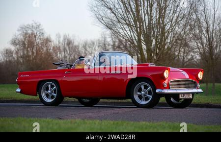 Stony Stratford,UK Jan 1st 2024. 1955 red Ford Thunderbird  car arriving at Stony Stratford for the annual New Years Day vintage and classic vehicle f Stock Photo