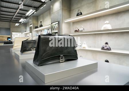 SINGAPORE - NOVEMBER 07, 2023: close up shot of black bag in Balenciaga store inside Singapore Changi Airport. Stock Photo