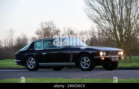 Stony Stratford,UK Jan 1st 2024. 1971 Jensen Interceptor  car arriving at Stony Stratford for the annual New Years Day vintage and classic vehicle fes Stock Photo