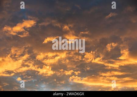 Clouds illuminated by setting sun Stock Photo