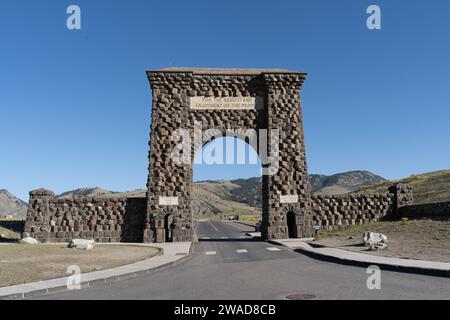 Historic Roosevelt Arch at the North Entrance of Yellowstone National Park, Gardiner Montana Stock Photo