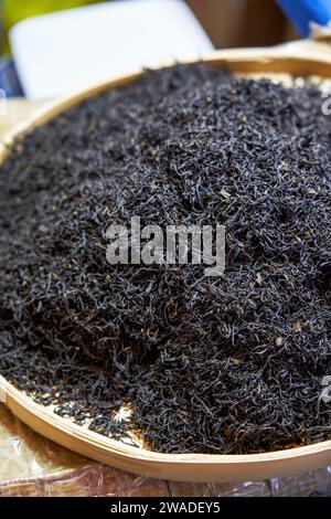 Close-up of a pile of Chinese tea leaves on a dustpan Stock Photo