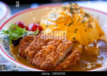 Close-up of a delicious Japanese fried pork cutlet omurice rice dish Stock Photo