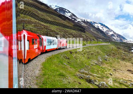 Zermatt 24,5,2023: Glacier Express red swiss train in Swiss Alps.Zermatt to St.Moritz. Switzerland in summer Stock Photo