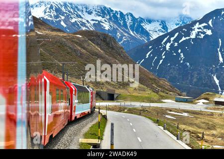 Zermatt 24,5,2023: Glacier Express red swiss train in Swiss Alps.Zermatt to St.Moritz. Switzerland in summer Stock Photo