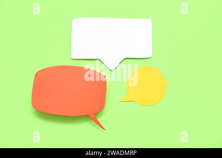 Blank speech bubbles on green background Stock Photo