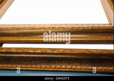 Antique wooden picture frames. Old rustic wooden frames close-up. Antique carved gilded frame. Selected focus Stock Photo