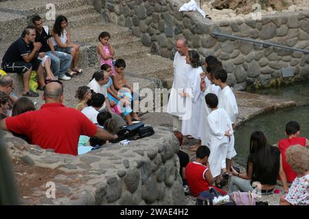 Baptismal site at Jordan river shore. Baptism of pilgrims  in Yardenit, Israel Stock Photo