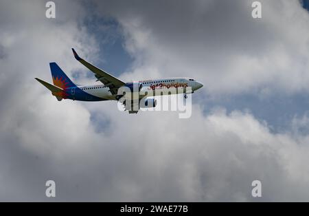 A low-angle of the Boeing 737-8MG of Jet2 Airline approaching Newcastle Airport on a cloudy day Stock Photo