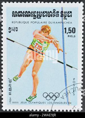 Cancelled postage stamp printed by Cambodia, that shows Pole vault, promoting Summer Olympics in Los Angeles, circa 1984. Stock Photo