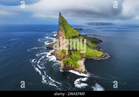 Faroe Islands Vagar, aerial drone view of Tindholmur island during ...